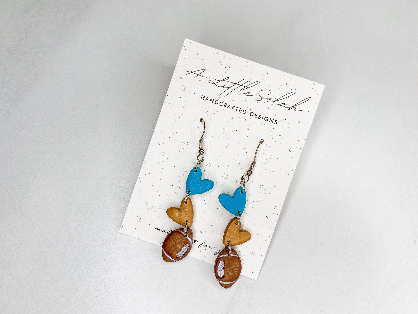 Football dangles in team colors