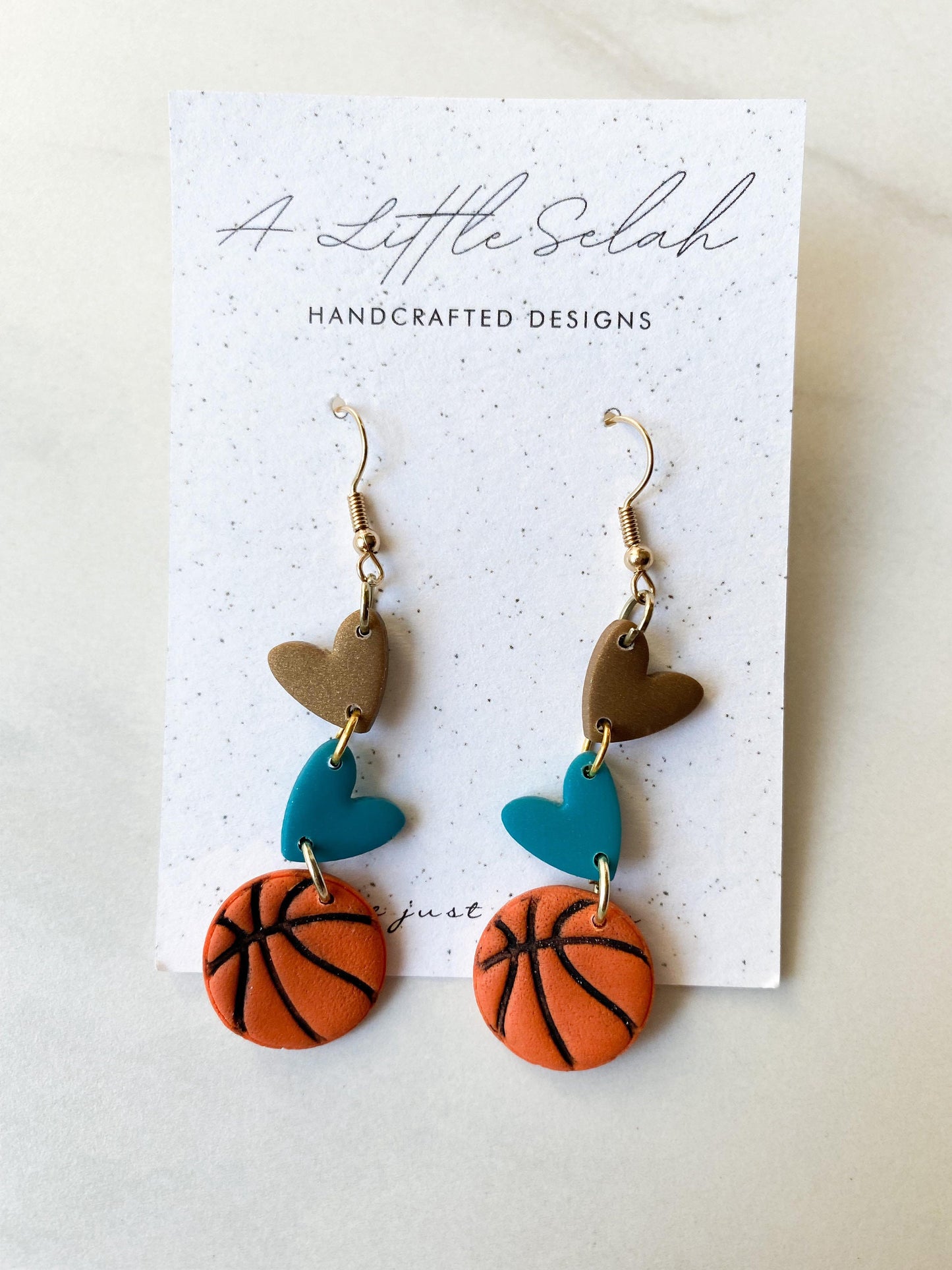 Basketball dangles in team colors