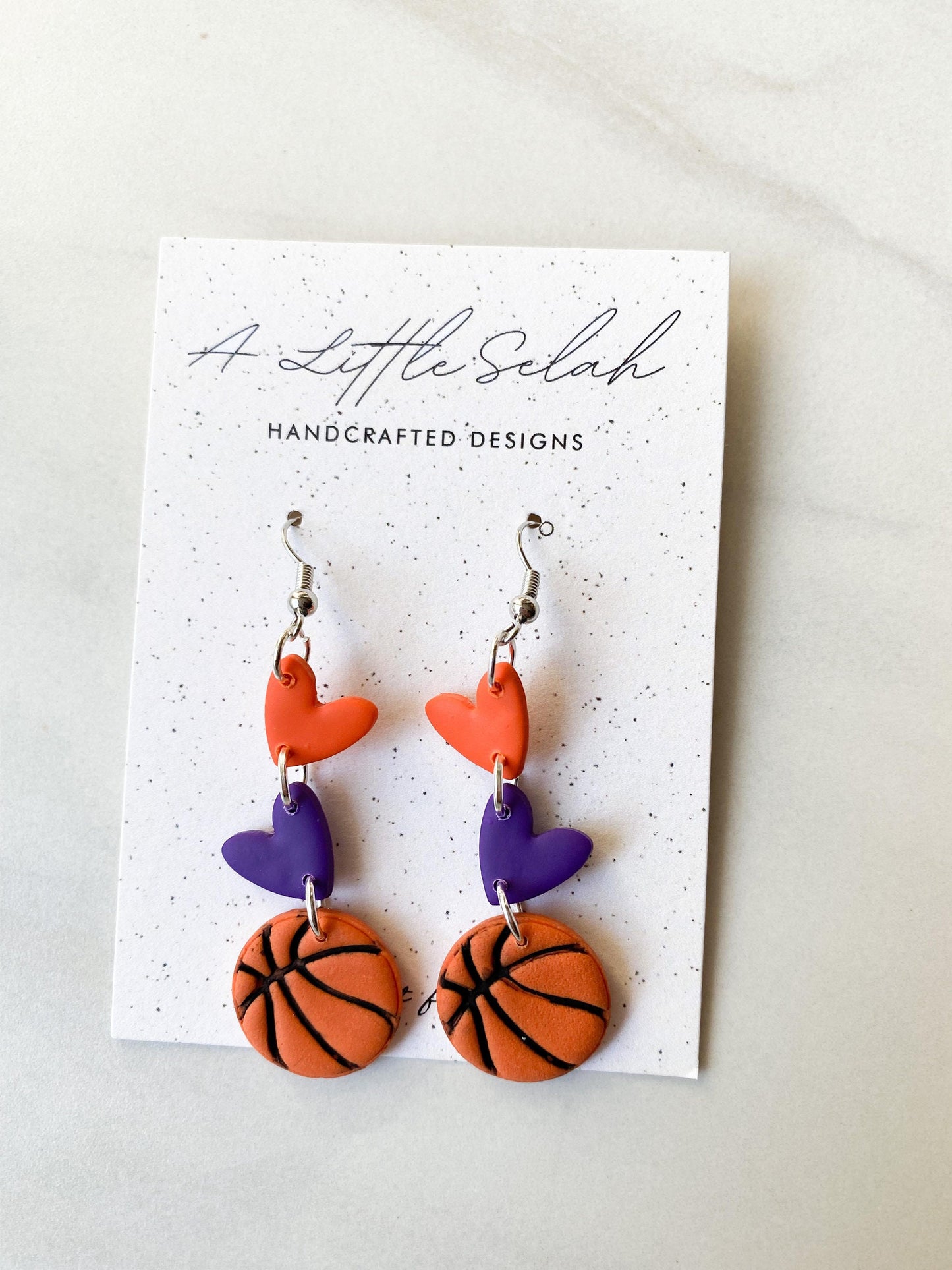 Basketball dangles in team colors