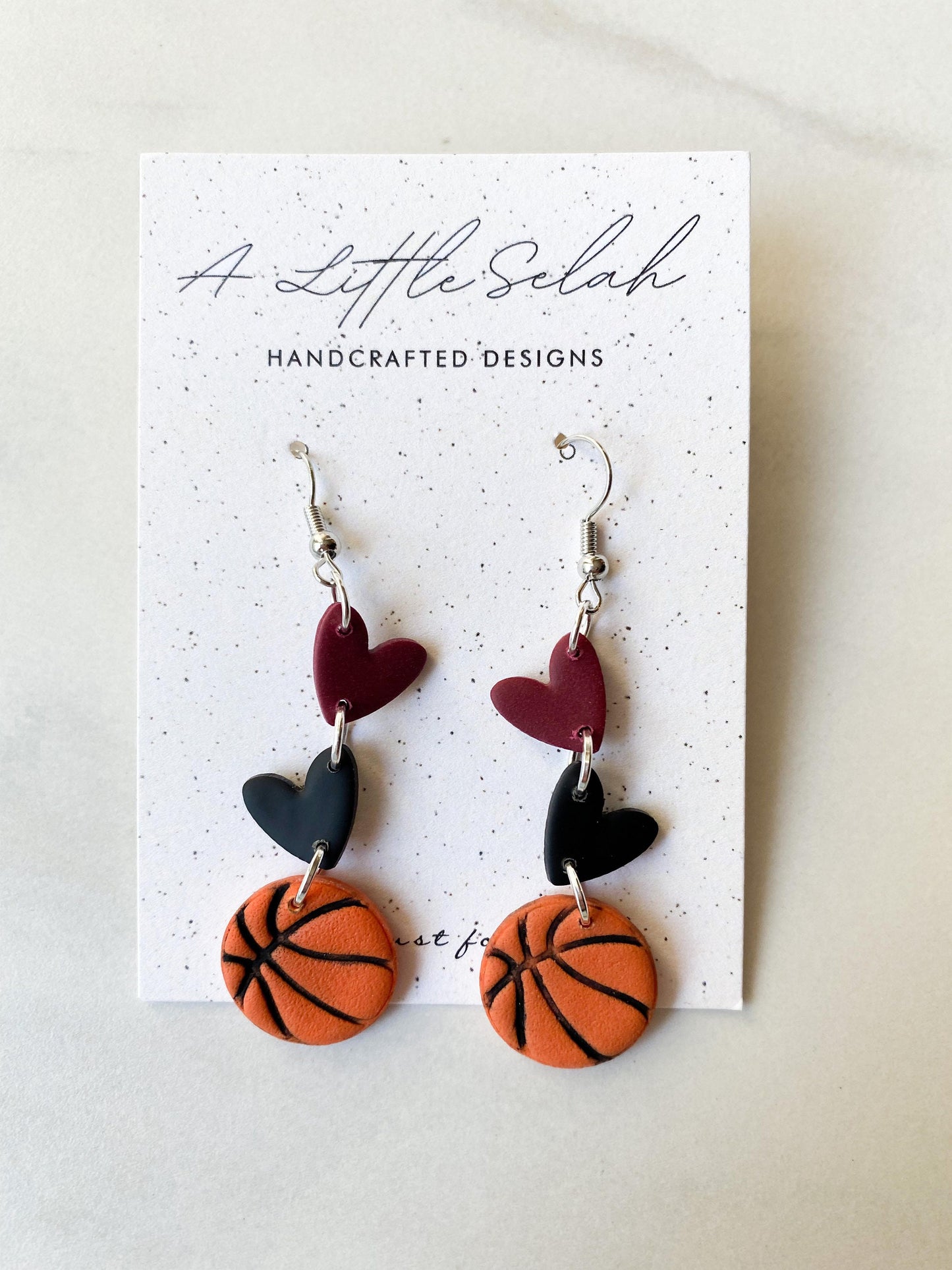 Basketball dangles in team colors